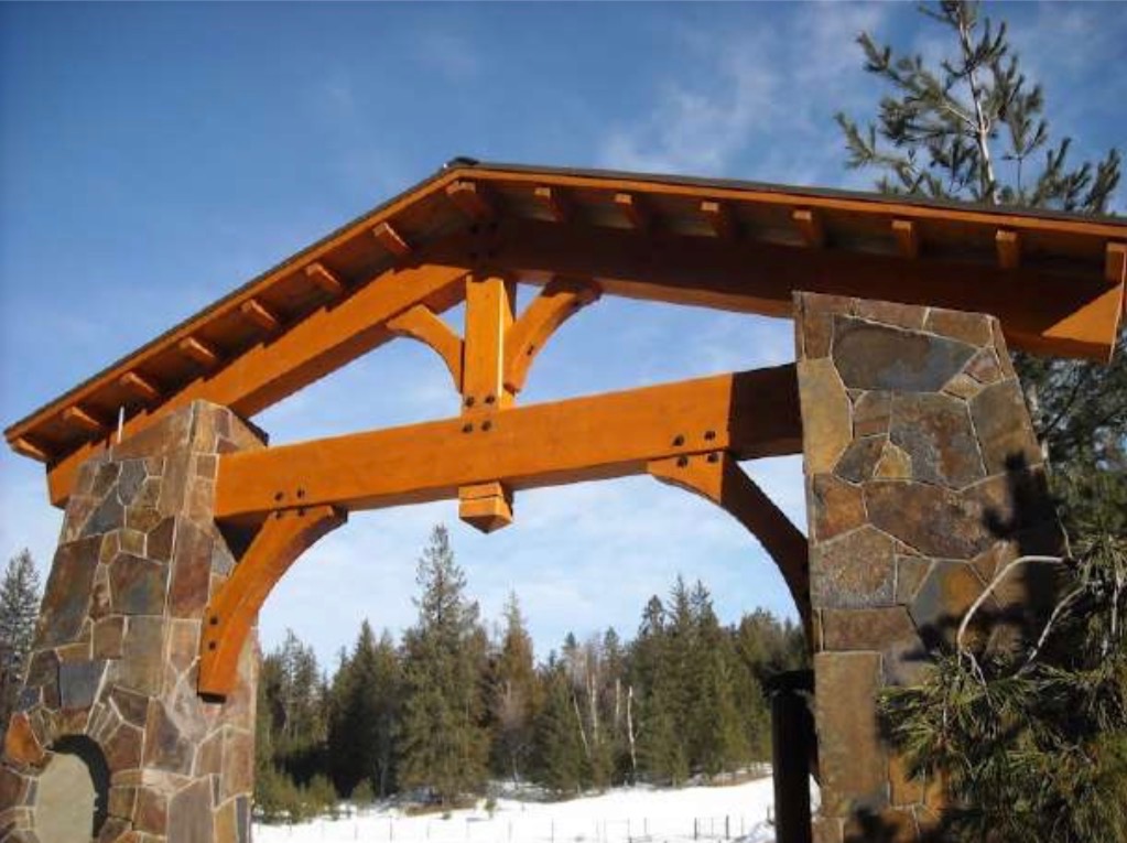 Custom timber truss entrance by Montana Beams