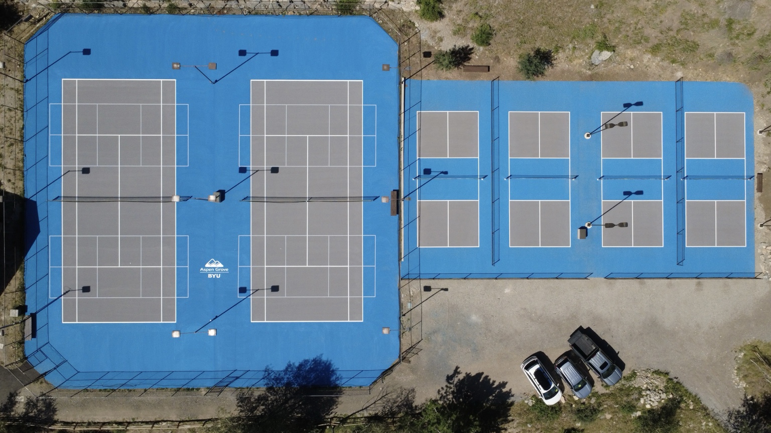 Blue and gray BYU tennis and pickleball courts built by Utah Athletic Courts